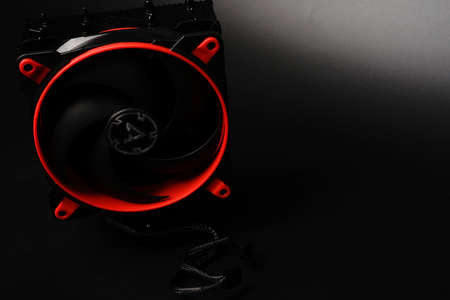 Moscow, Russia - march 3 2021: The branded tower fan for gamers to cool the PC CPU is isolated on a black background. Increased power and black and red color. Copyspaceのeditorial素材