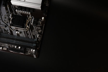 Moscow, Russia - march 3 2021: A modern branded Motherboard PC on a black background with space for text.のeditorial素材