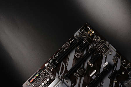 Moscow, Russia - march 3 2021: A modern branded Motherboard PC on a black background with space for text.のeditorial素材