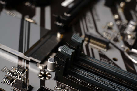 Moscow, Russia - march 3 2021: Macrophotograph of a modern branded Motherboard PC. Dimmed lightsのeditorial素材