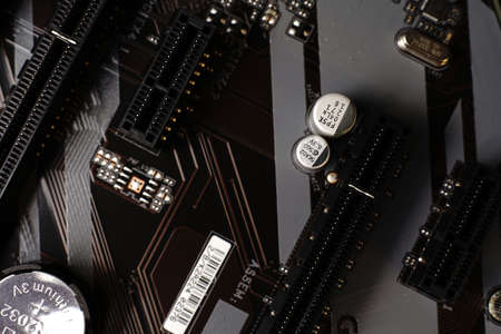 Moscow, Russia - march 3 2021: Macrophotograph of a modern branded Motherboard PC. Dimmed lightsのeditorial素材