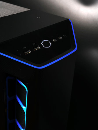 Moscow, Russia - march 3 2021: Modern beautiful black with blue stripes computer system unit PC on a...