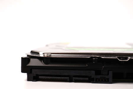 Part of a Sata hard drive for storing information on a white background with space for text. Closeup.の写真素材