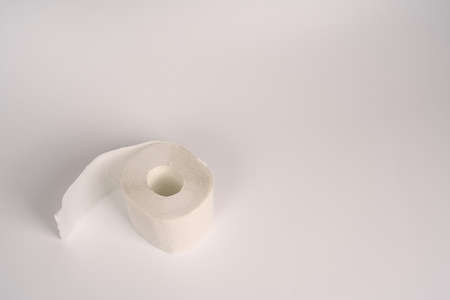 A roll of toilet paper on a white background. Top view. Space for textの写真素材