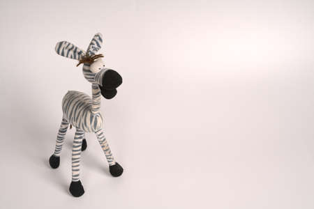 Moscow, Russia - may 30 2021: Cute stuffed toy in the form of a zebra on a white background. Plenty of room for textのeditorial素材