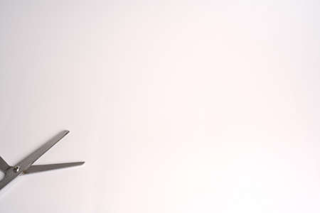 Open scissors blades on a white background.の写真素材