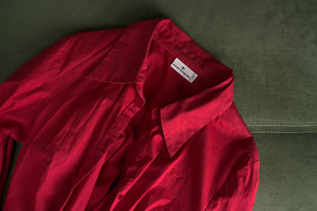 Moscow, Russia - june 8 2021: Womens shirt in bright red Tom Tailor. Flatlayのeditorial素材