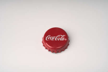 Moscow, Russia - june 18 2021: Metal coca-Cola bottle cap on white background. Isolate. Space for the textのeditorial素材
