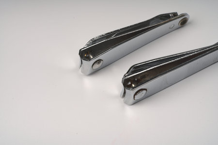 Two nail clippers folded on a white background.