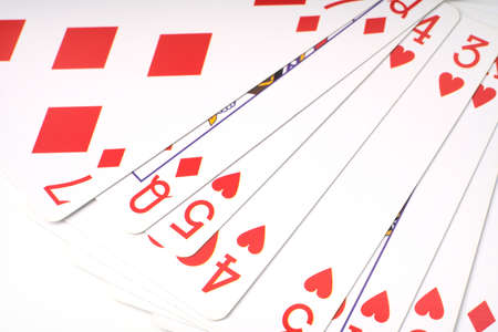 Closeup playing cards on a white background. Only the red suit.の写真素材