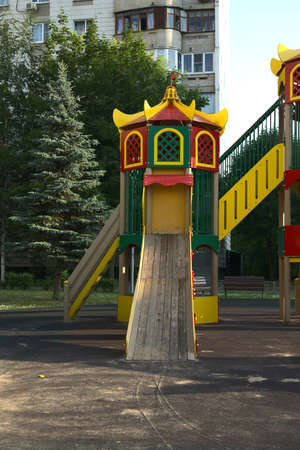 Moscow, Russia - june 27 2021: Part of the playground with a slide on which children can roll down in the courtyard of the house. A vertical snapshotのeditorial素材