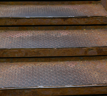 Metal rusty steps that are still being walked onの写真素材