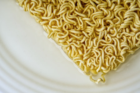 Closeup instant noodles on a plate.の写真素材