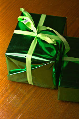 Two New Years gifts on a wooden background.の写真素材