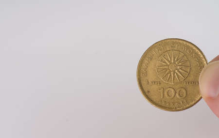 MOSCOW, RUSSIA-November 17, 2021: Coin in 100 drachmas obverse side white background closeupのeditorial素材
