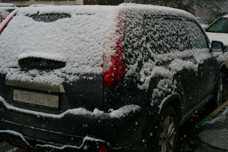 MOSCOW, RUSSIA-November 22, 2021: The car is covered in snow on the street in winter. Closeのeditorial素材