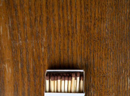Boxes of matches on a wooden background top view. Closeup.の写真素材