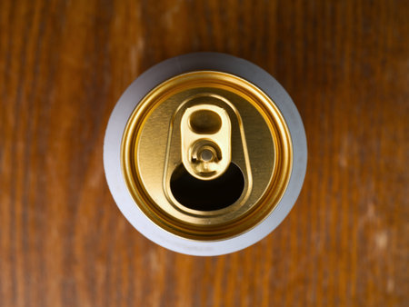 Aluminum can with beer top view.