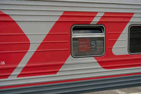 MOSCOW, RUSSIA-August 10, 2021: The side of a passenger car at the Kazan railway station. The inscription of the direction of movement Penza - Moscow. And a big inscription in red RZDのeditorial素材