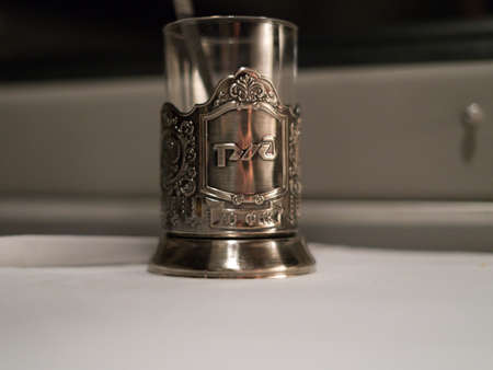 SARAI, RUSSIA-August 20, 2021: The famous glass with a metal cup holder for tea from Russian Railways.のeditorial素材