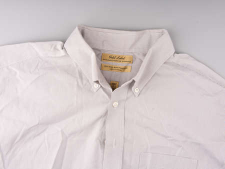 MOSCOW, RUSSIA-February 23, 2022: Branded light pinstriped shirt. The upper part. On a gray backgroundのeditorial素材