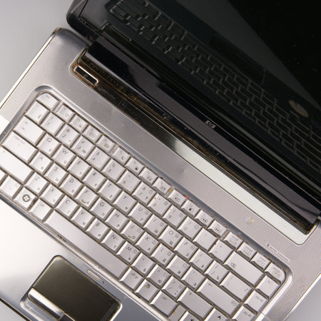 MOSCOW, RUSSIA-February 23, 2022: An open old HP laptop from 2005. The keyboard and part of the...