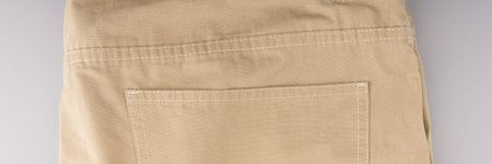 The back of light trousers folded in half. Top view.の写真素材