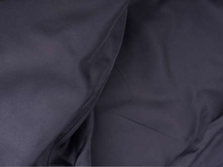 The texture of the folds of the lining of the jacket. All in black tones. Closeupの写真素材