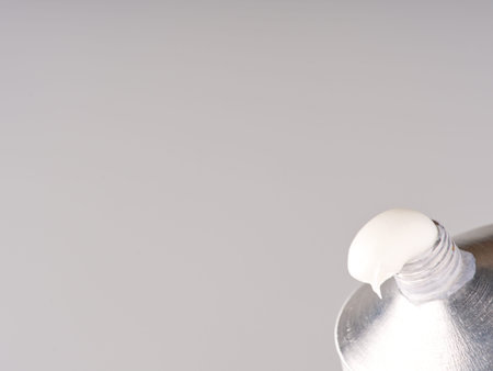 A tube of hand cream on a gray background. Closeup.の写真素材