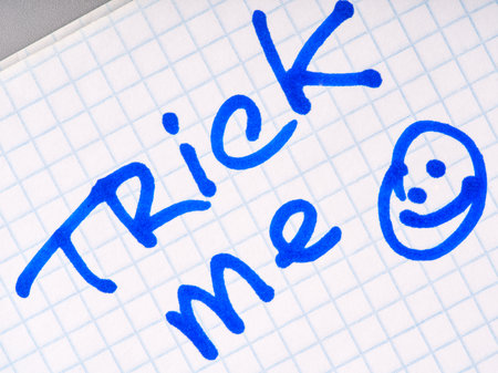 The inscription on the notebook sheet trick me and smile. The concept of try to deceive meの写真素材