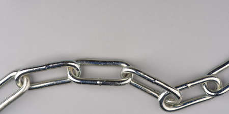 Large metal chain on a gray background. View from aboveの写真素材