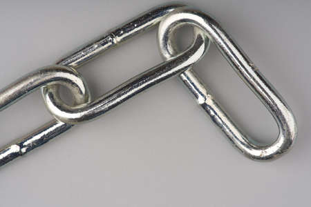 Large metal chain on a gray background. Closeupの写真素材