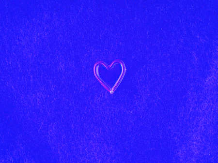 Heart on fabric in blue tones closeupの写真素材