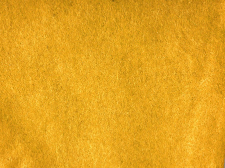 The texture of the fabric is yellow closeup. A shade reminiscent of mustardの写真素材