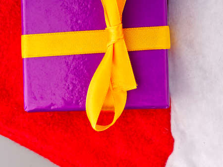A gift box on Santa Clauss hat closeupの写真素材