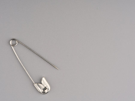 Clothing pin on a gray background closeup. Space for textの写真素材