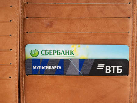 MOSCOW, RUSSIA-February 23, 2022: Credit cards of two leading Russian banks in a wallet. VTB and Sberbank. Sanctionsのeditorial素材