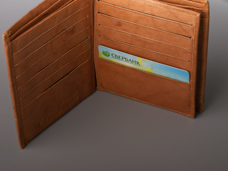 MOSCOW, RUSSIA-February 23, 2022: The credit card of the Russian bank Sberbank in the wallet is not a gray backgroundのeditorial素材