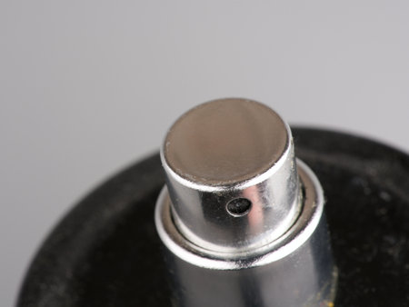 Silver perfume cap closeup. On a gray backgroundの写真素材