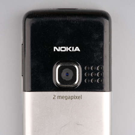 MOSCOW, RUSSIA-February 23, 2022: An old Nokia mobile phone closeup . The phones camera is visibleのeditorial素材