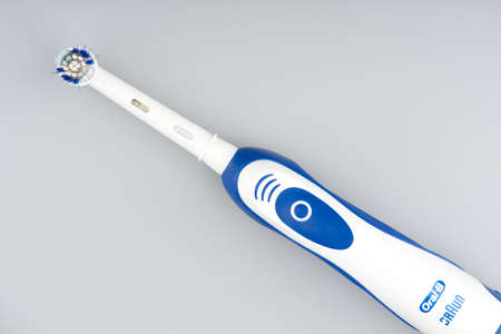 MOSCOW, RUSSIA-February 23, 2022: Branded electric toothbrush on a light gray background. Closeupのeditorial素材