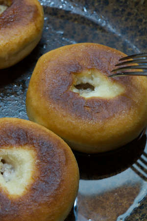 Meat donuts fried in a frying pan. Vertical shot.の写真素材