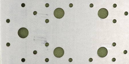 The texture of the metal sheet and the holes in it. Closeupの写真素材