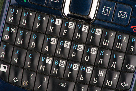 Moscow, Russia-September 16, 2022: QWERTY keyboard on an old push-button phone. Closeupのeditorial素材