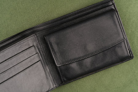 Wallet on a green background. Closeup. Top viewの写真素材