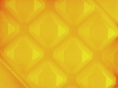Texture with rotated squares in bright yellow. View from aboveの写真素材
