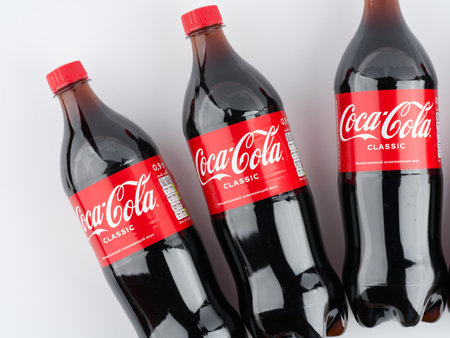 Moscow, Russia-September 16, 2022: Three bottles of Coca Cola on a white background. Top viewのeditorial素材