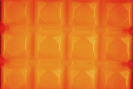 Texture with squares in bright orange color. View from aboveの写真素材