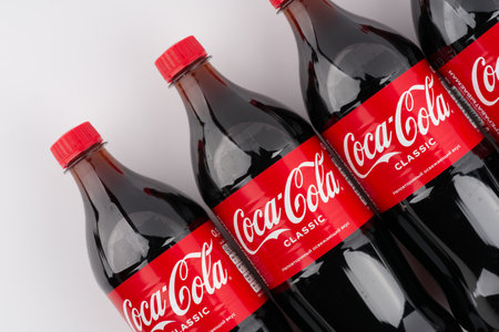 Moscow, Russia-September 16, 2022: Four bottles of Coca Cola on a white background. View from above. Place for textのeditorial素材