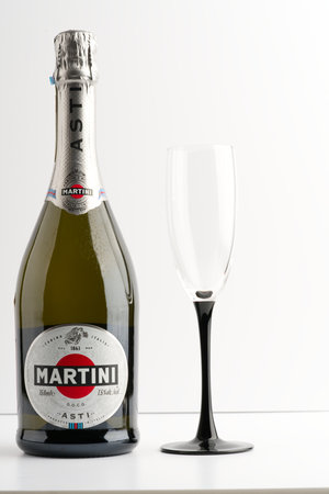 Moscow, Russia-September 16, 2022: A Martini bottle and a glass on a white backgroundのeditorial素材